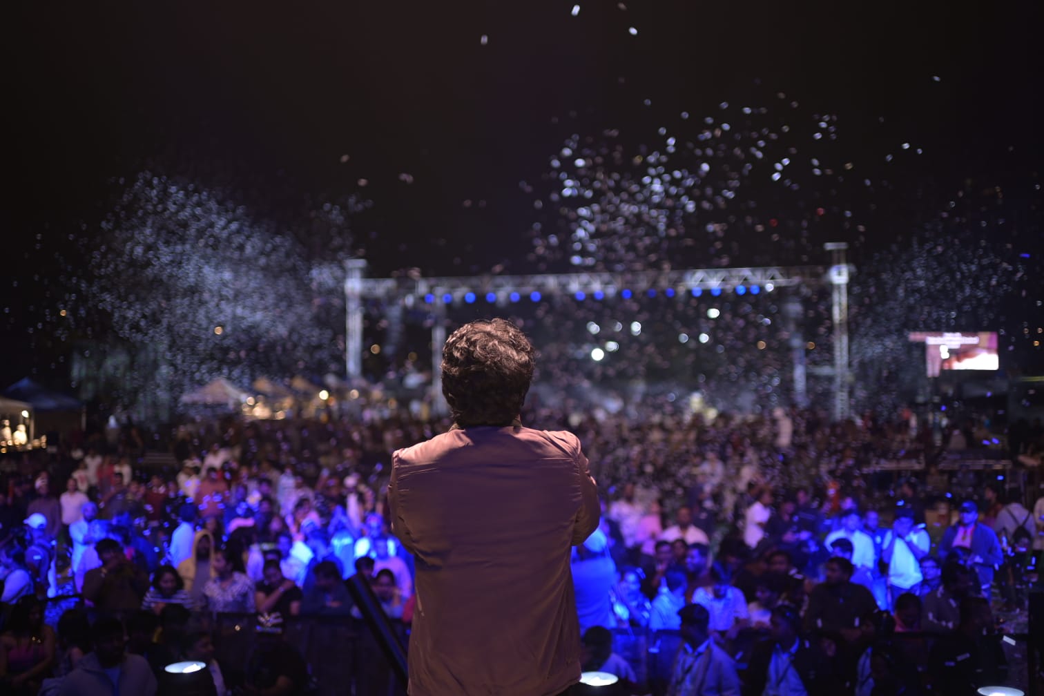 Performer on stage with confetti