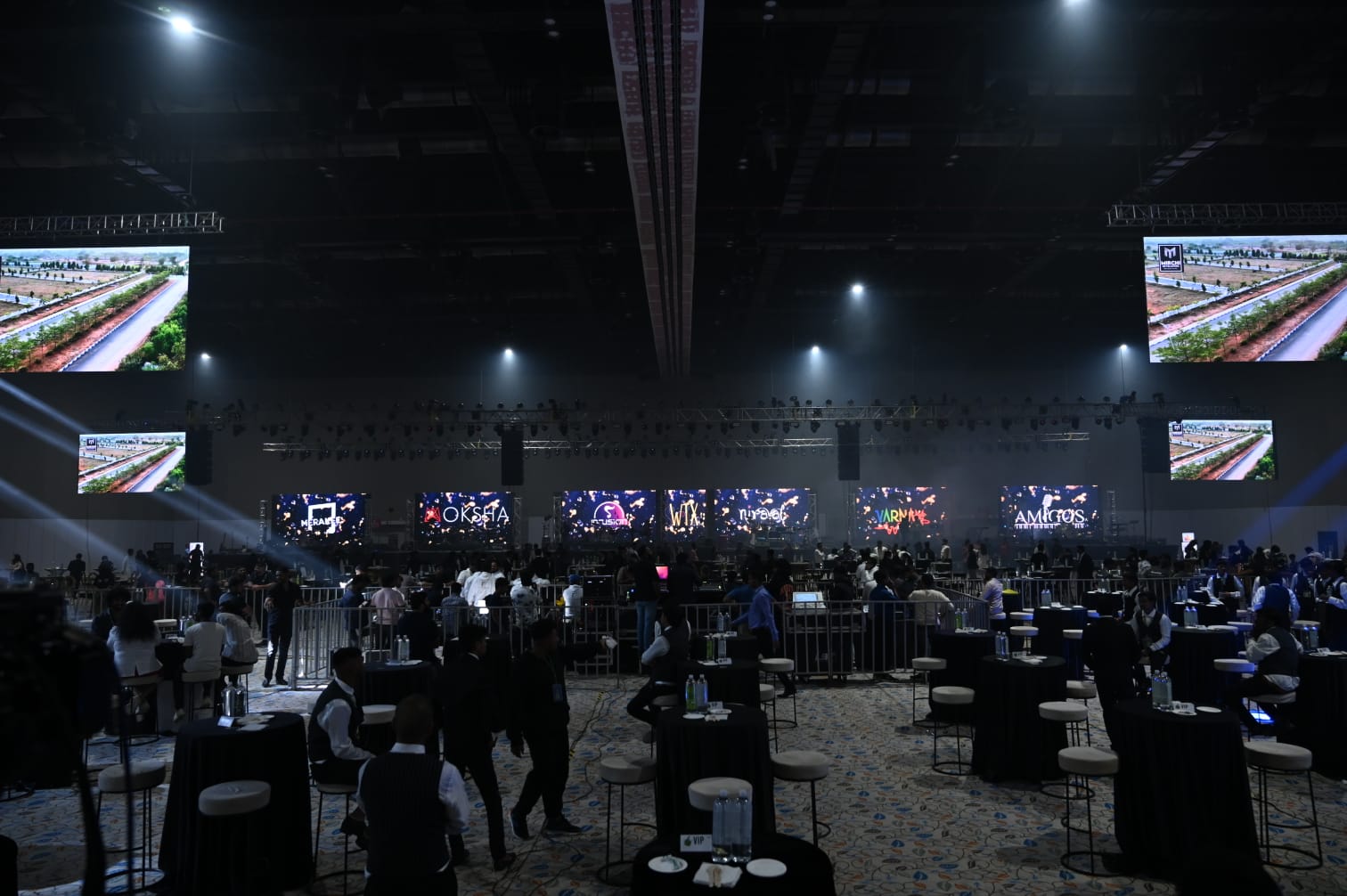 Main hall set up with LED screens and VIP lounges
